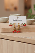 Çelik Kiraz Küpe Seti 6 lı – Gold Renk, Mineli Taşlı Kiraz Figürlü, Günlük & Şık Kullanım