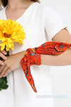 a close up of a person holding a red tie 